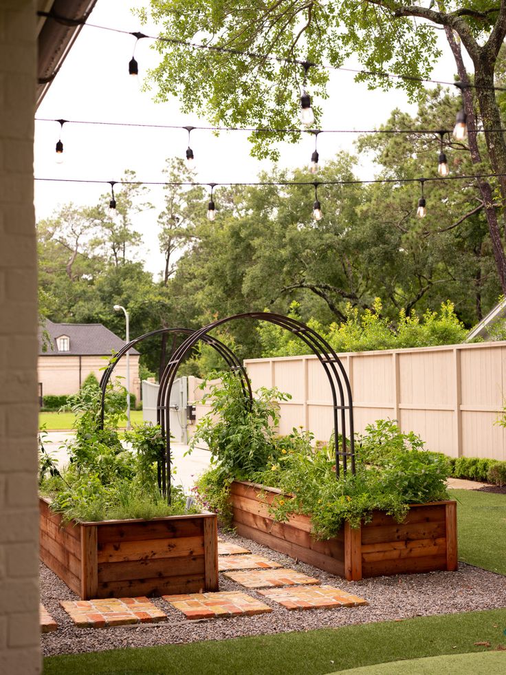 an outdoor garden area with several wooden planters