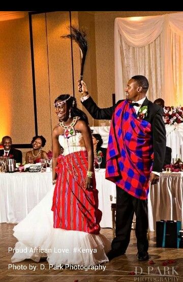 a man and woman standing next to each other on a dance floor