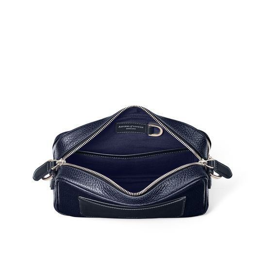 Reporter East-West Navy Leather Messenger Bag | Aspinal Everyday Luxury Epsom Leather Textured Bags, Travel Shoulder Bag In Textured Epsom Leather, Luxury Navy Crossbody Bag, Travel Satchel In Textured Epsom Leather, Timeless Textured Leather Bag For Business Trips, Everyday Luxury Epsom Leather Shoulder Bag, Luxury Navy Shoulder Bag With Detachable Strap, Classic Textured Leather Satchel For Everyday Luxury, Classic Textured Leather Satchel