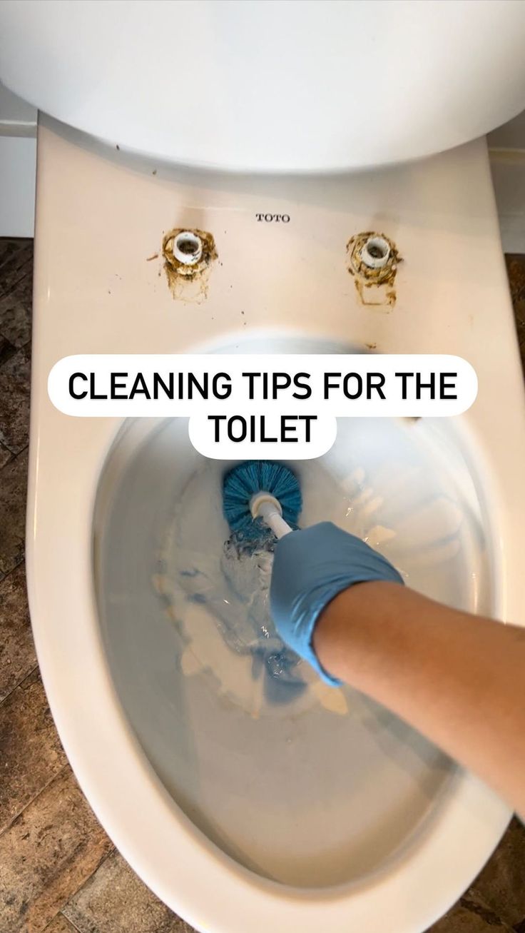 a person cleaning a toilet bowl with blue gloves on it and the words cleaning tips for the toilet