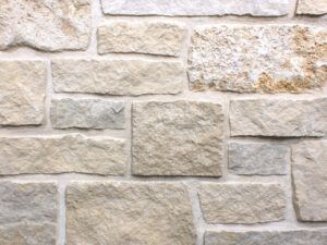 a stone wall that is made out of different types of stones