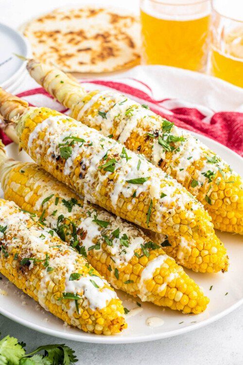 grilled corn on the cob with cheese and herbs