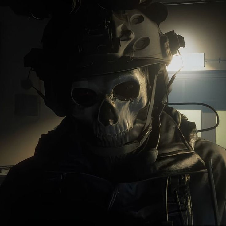 a skeleton wearing a helmet and goggles in a dark room with light coming through the window