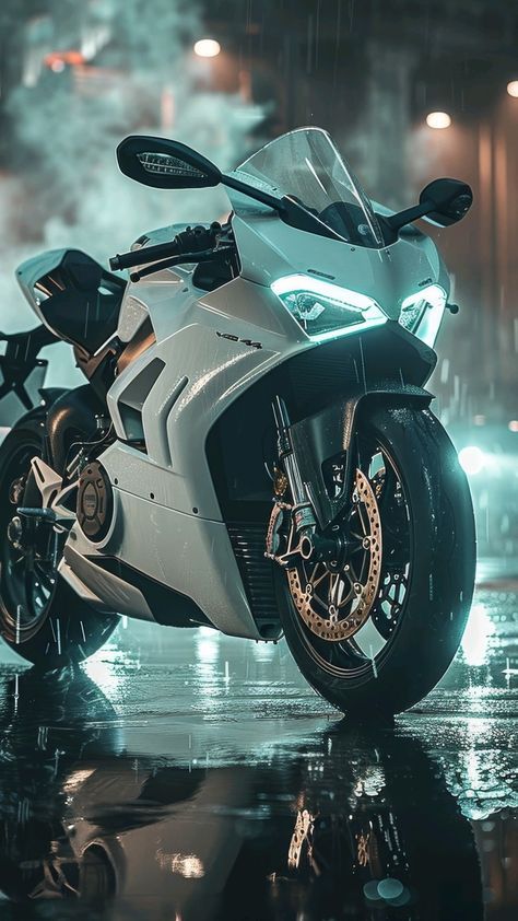 a white motorcycle parked on top of a wet ground