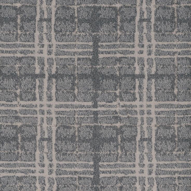 a gray and white rug with squares on it