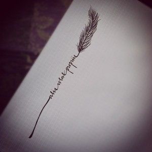 an ink drawing of a feather on paper