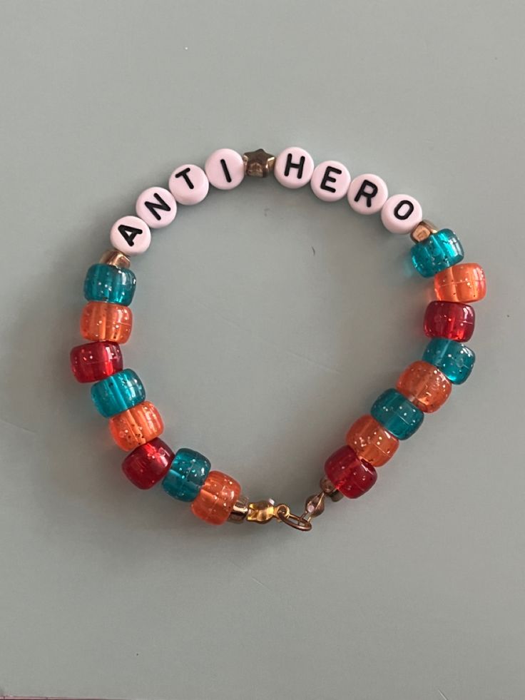 Eras Tour Anti Hero Outfit, Eras Movie Bracelet Ideas, T Swift Bracelet Ideas, Anti Hero Taylor Swift Bracelet, Taylor Swift Friendship Bracelet Ideas Midnights, Midnight Friendship Bracelet, Midnights Taylor Swift Bracelet, Friendship Bracelets Beads Ideas, Anti Hero Bracelet