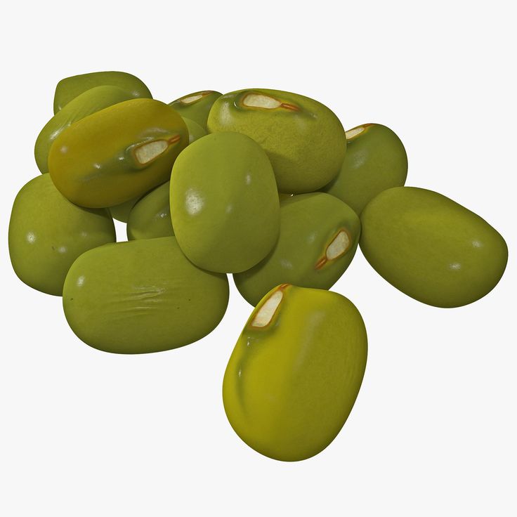 some green olives are piled on top of each other