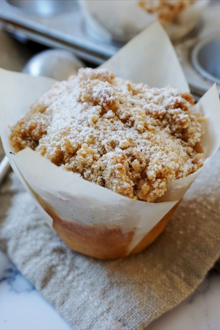 a muffin sitting on top of a napkin