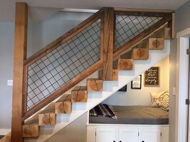 the stairs are made out of wood and have been built into the wall above them