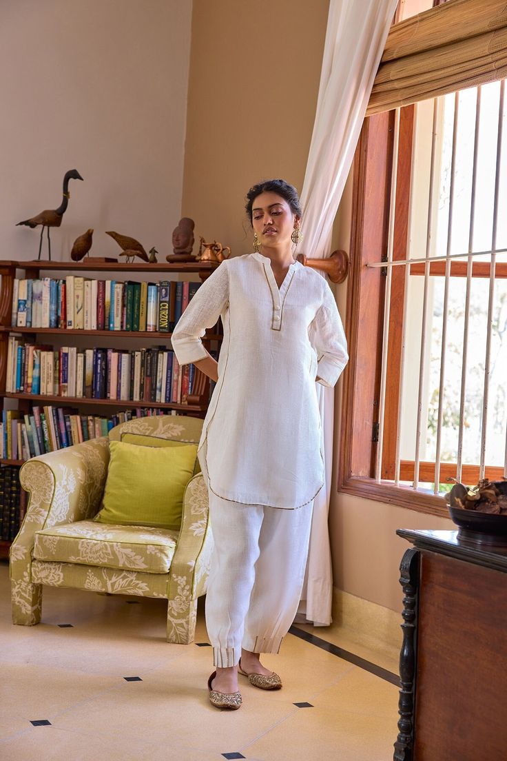 Minimal, comfortable, and chic, the Neroli Kurti is designed to bring light and warmth in the lives of all those around you. This gauze linen short kurta features gota work on the edges and can be dressed up or down depending on the occasion. Short Kurta Neck Design, Short Kurtas Women, Short Kurta Set, Summer Linen Straight Kurta, Summer Straight Linen Kurta, Straight Linen Kurta For Summer, Summer Linen Kurta With Chikankari Embroidery, White Linen Straight Kurta, Casual Linen Kurta Tunic