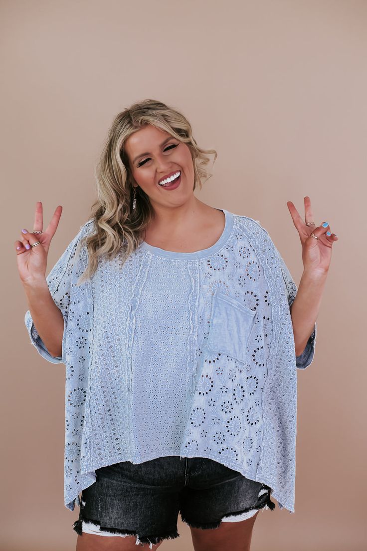 Step into spring with style this fun and flowy eyelet top is sure to make you stand out this season! The Oversized Eyelet Shirt has a mineral-washed finish and playful eyelet details throughout, this top is perfect for embracing the spring vibes. Plus, the oversized fit ensures extra comfort and style all season long! Eyelet cutout detail Oversized Mixed fabric High-low hem. Functional front pocket Fabric: 100% Cotton Fit: Oversized fit you 100% can size down in this! Model Specs: Syd is wearing Oversized Light Wash Tops For Spring, Oversized Blue Bohemian Top, Oversized Washed Tops For Day Out, Blue Cotton Pointelle Knit Tops, Spring Eyelet Blouse With Relaxed Fit, Spring Oversized Washed Tops, Spring Light Wash Relaxed Fit Tops, Casual Pointelle Knit Blouse For Summer, Oversized Washed Tops For Spring