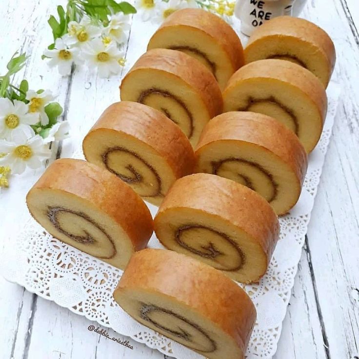 several rolls sitting on top of a white doily