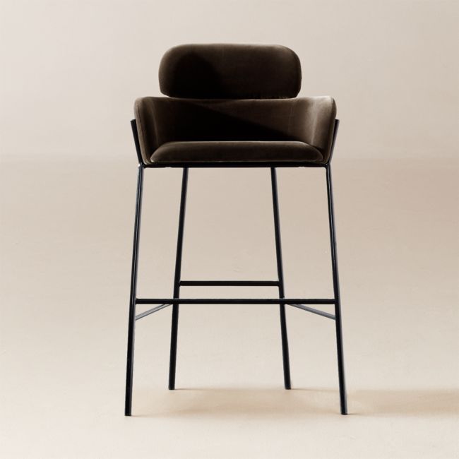 an upholstered bar stool with a black leather seat and backrest, viewed from the front