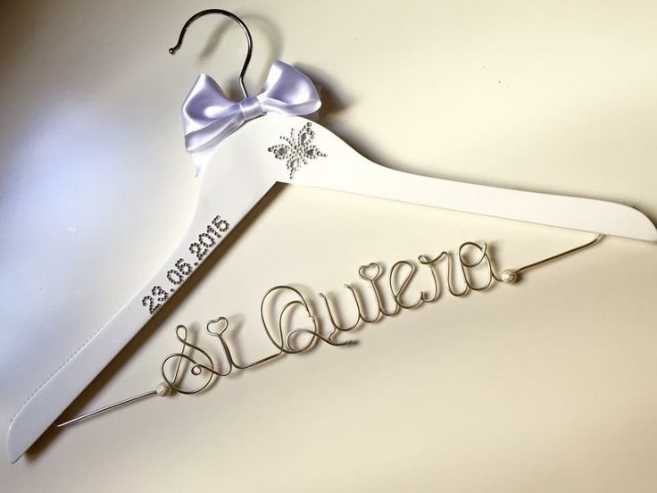 a wedding dress hanger with the word bridal written on it