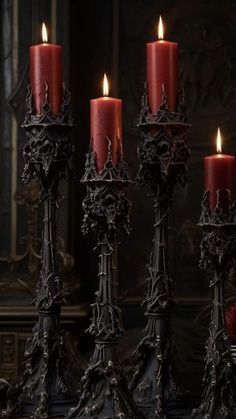 a group of red candles sitting on top of a table