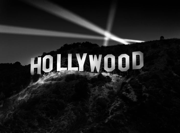 the hollywood sign is lit up in black and white