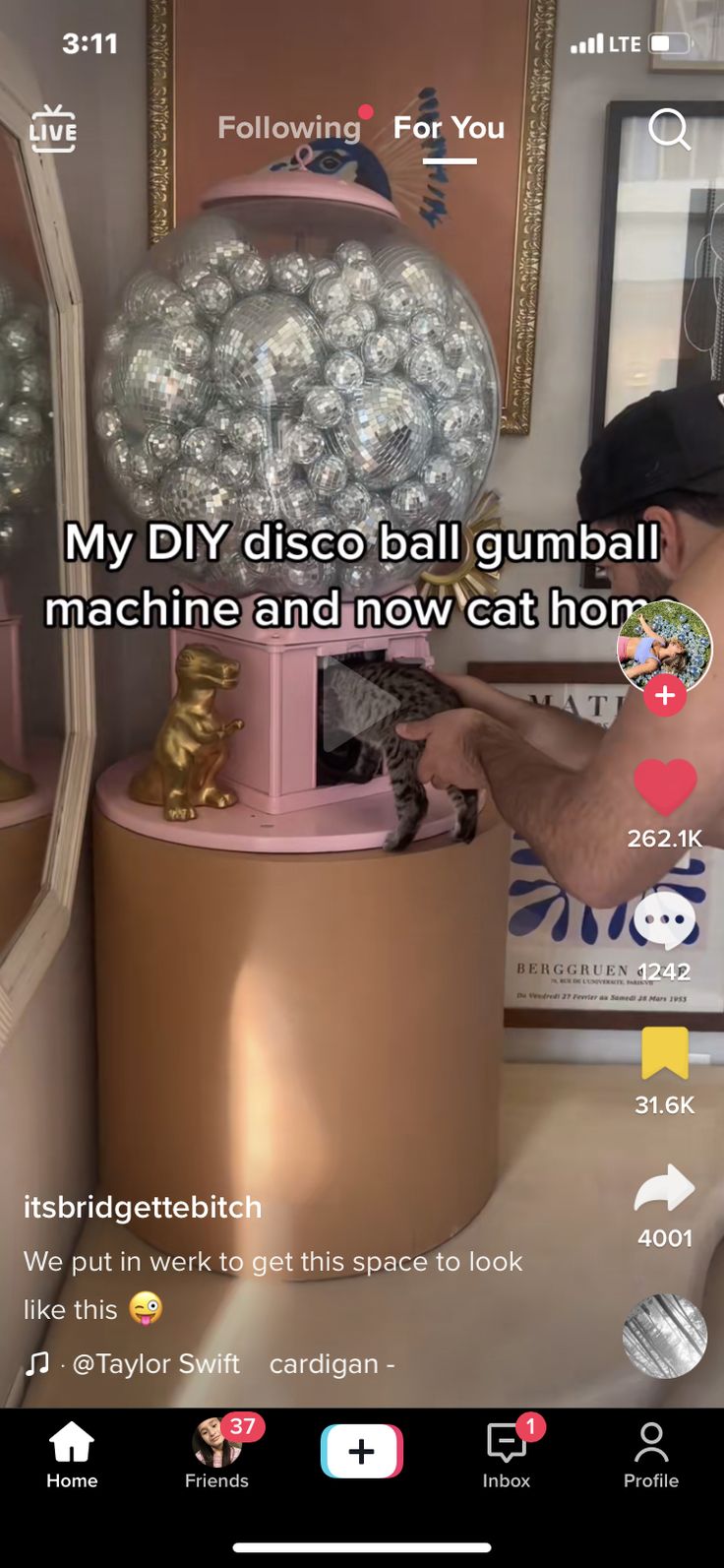 a man that is standing in front of a machine with lots of balls on it