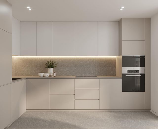 an empty kitchen with white cabinets and counter tops