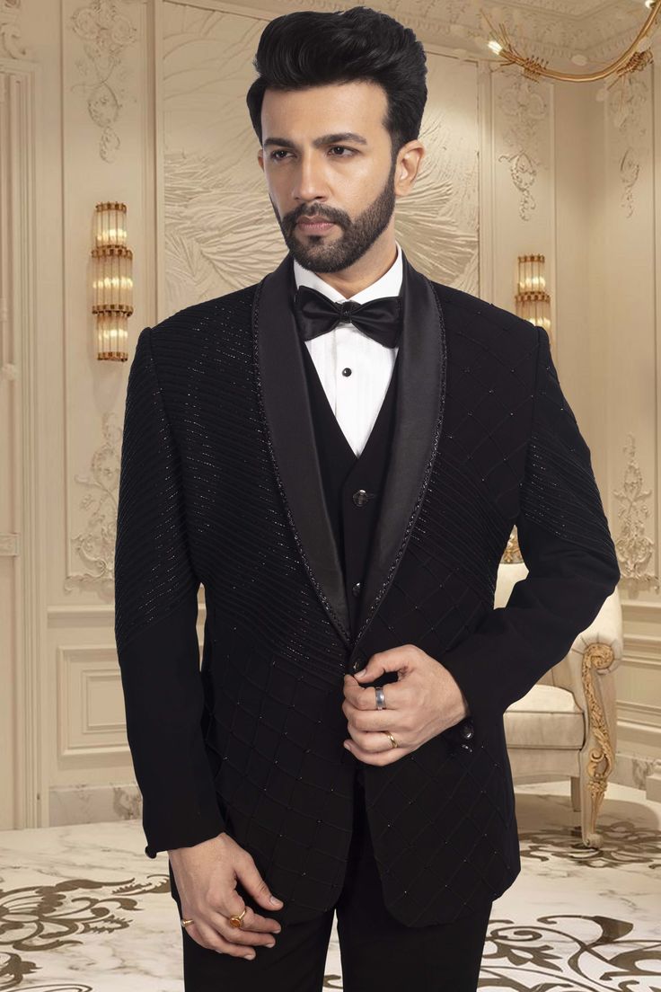 This TUXEDO- R14-S63 showcases stunning black cutdana embroidery, adding a touch of elegance and sophistication to your ensemble. Expertly crafted with precision and attention to detail, this tuxedo is the perfect choice for any formal occasion. Its intricate design is sure to make you stand out in the crowd. Designer Black Tuxedo For Groom, Black Tuxedo For Groom Festive Occasion, Festive Black Tuxedo For Groom, Festive Black Blazer For Groom, Black Three-piece Tuxedo For Black Tie Events, Luxury Black Blazer For Black Tie Events, Designer Black Fitted Sherwani, Designer Fitted Black Sherwani, Black Fitted Bandhgala For Semi-formal Occasions