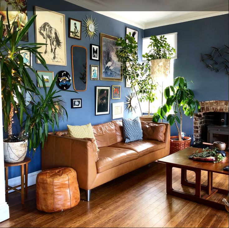 a living room with blue walls and wooden floors