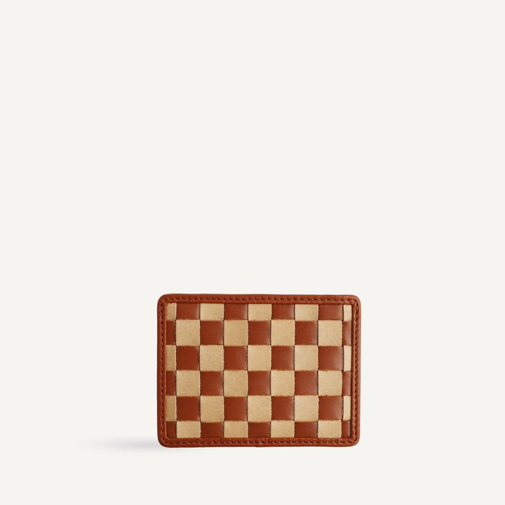 a brown and white checkered wallet