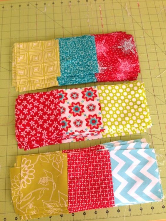 four blocks of fabric laid out on a cutting board