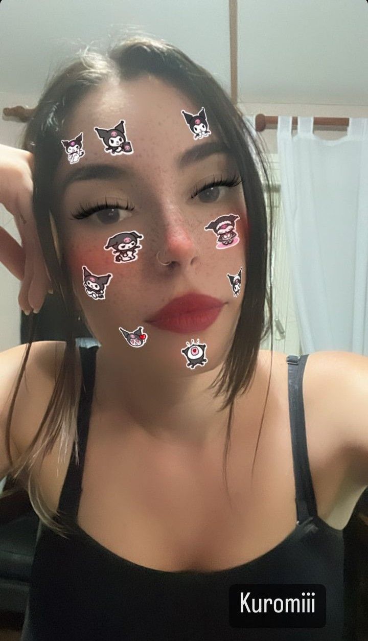 a woman with cat stickers on her face