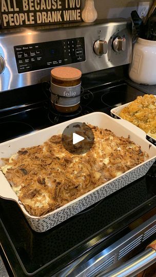 two pans of food sitting on top of an oven