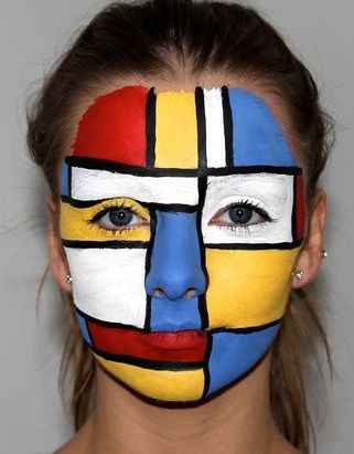 a woman's face is painted in different colors