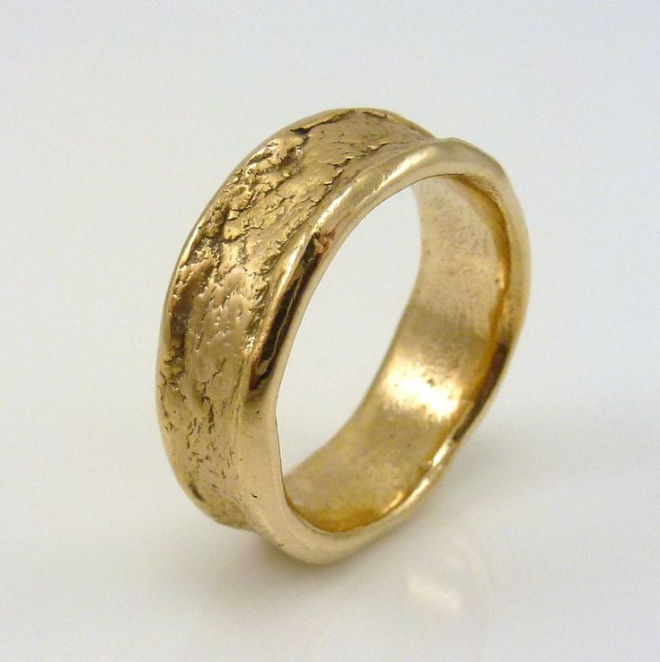 "Organic Bronze Ring, ARCADIAN, Textured Bronze Ring, Men's or Women's The edges of the ring have been slightly rolled over and mirror polished, and the center of the ring is textured with a matte finish Width is +/- 1/4\"and will vary  ADDITIONAL INFORMATION: Every ring is handmade and is a \"one-of-a-kind\" and unique work of art. Each ring is unique and will be similar to the images but may vary slightly in width and pattern.   Many rings have their own character with organic edges, undulating surfaces and textures.   ABOUT BRONZE:   Bronze is an ancient metal and is composed of approximately 90% copper and 10% tin and not suitable to those with copper allergies as it may turn your finger green. It does not apply to everybody but please be aware that this might happen. It is NOT a fault Bronze Ring Men, Bronze Rings, Colored Rings, Silver Initial Ring, Many Rings, Rustic Rings, Viking Ring, Ruby Diamond Rings, Princess Cut Rings