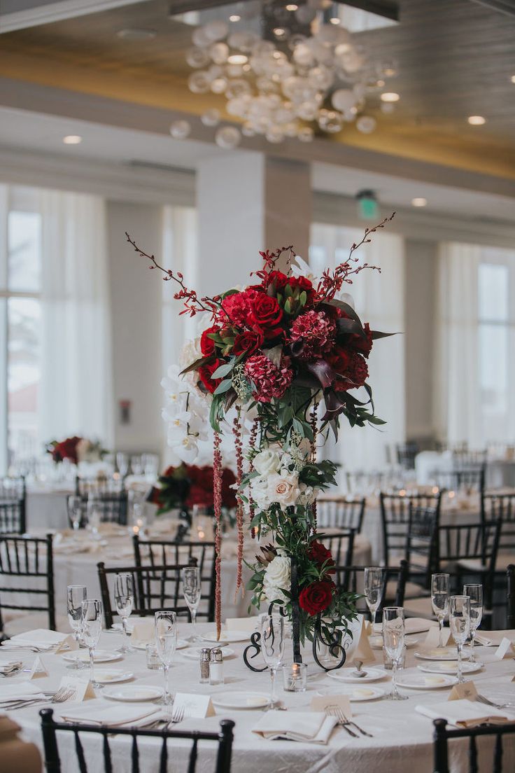 an image of a table set up with flowers and candles for a wedding or special event