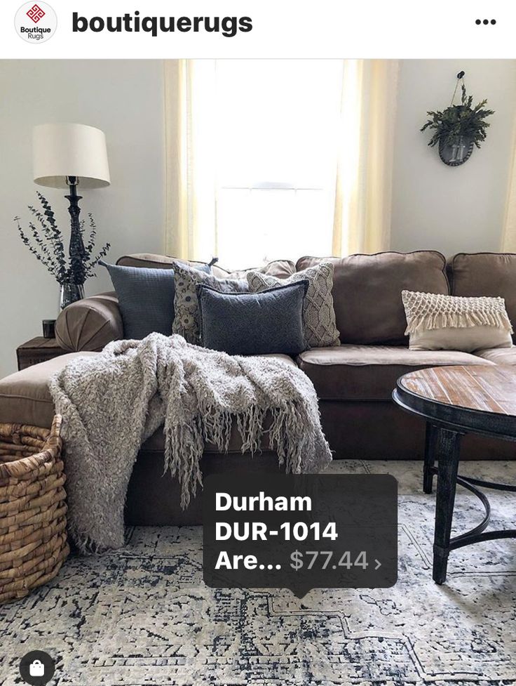 a living room filled with furniture and pillows