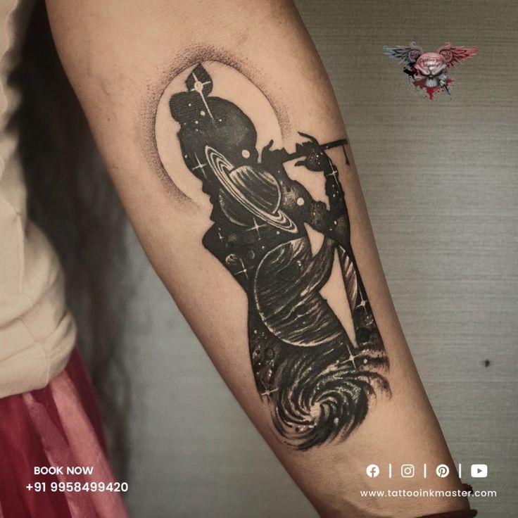 a woman's arm with a black and white tattoo on it