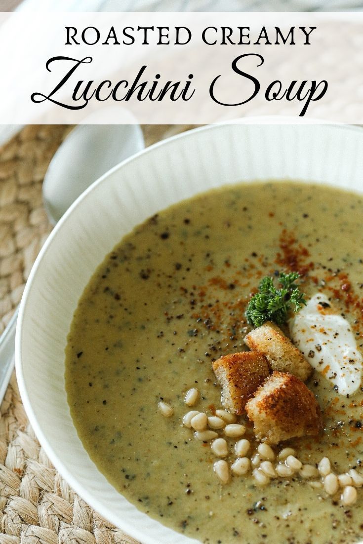 a white bowl filled with soup on top of a table