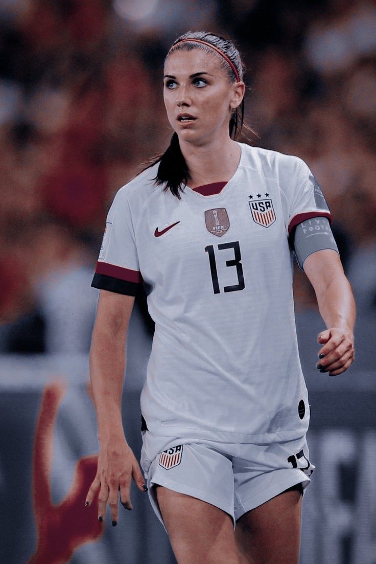 a female soccer player in action on the field