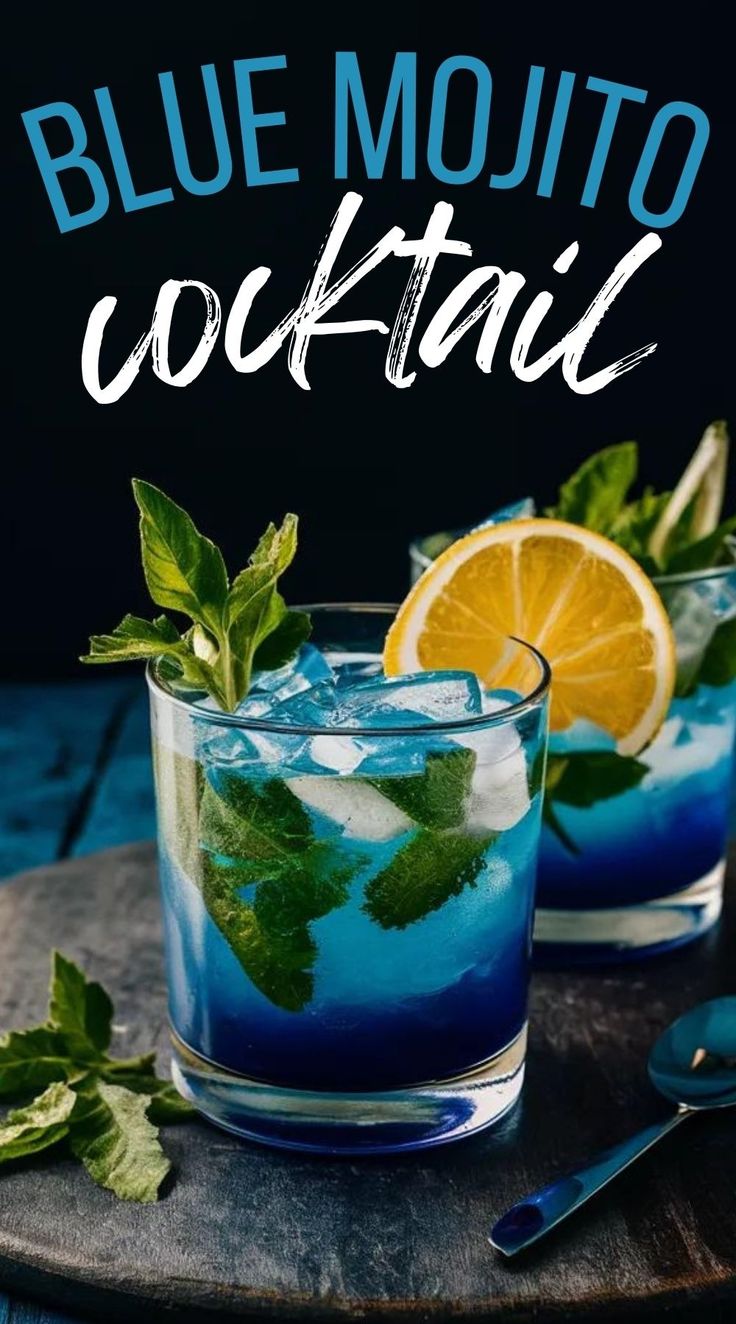 two glasses filled with blue mojito cocktail