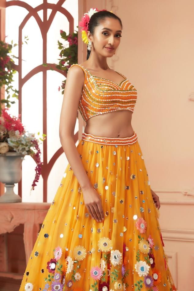 Yellow lehenga featuring floral embroidery with 3D resham and sequin appliqués. Paired with a padded blouse embellished with sequins, cutdana, and mirrors., Fit: Relaxed Fitted Sleeveless Lehenga For Celebration, Summer Wedding Choli With Cutdana Details, Summer Wedding Choli With Cutdana, Wedding Choli With Pallu For Summer, Summer Wedding Lehenga Embellished, Summer Wedding Embellished Lehenga, Summer Party Lehenga With Cutdana, Summer Wedding Organza Lehenga, Fitted Organza Lehenga For Summer