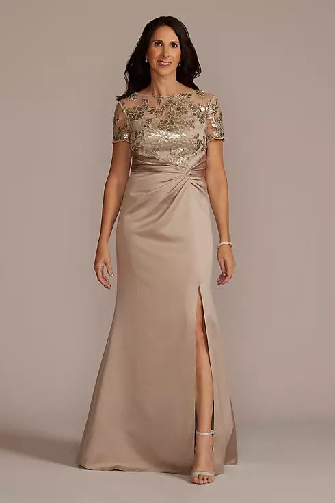 a woman in a long dress with a slit down skirt and gold sequins