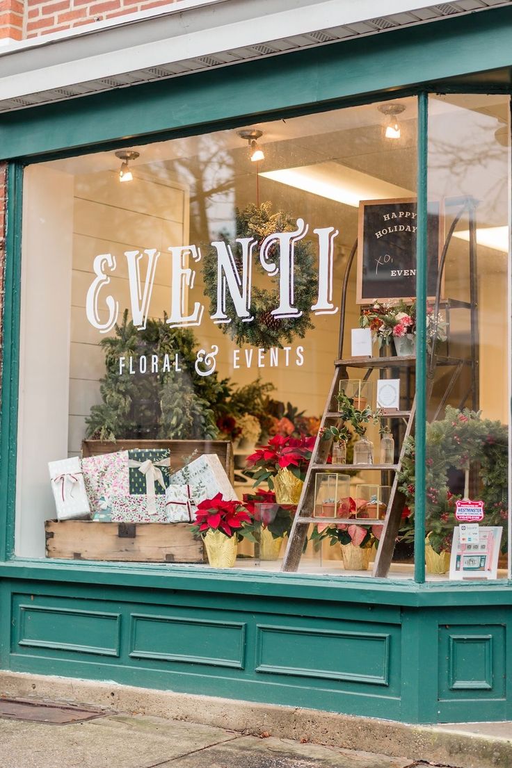 the front window of a floral and events store