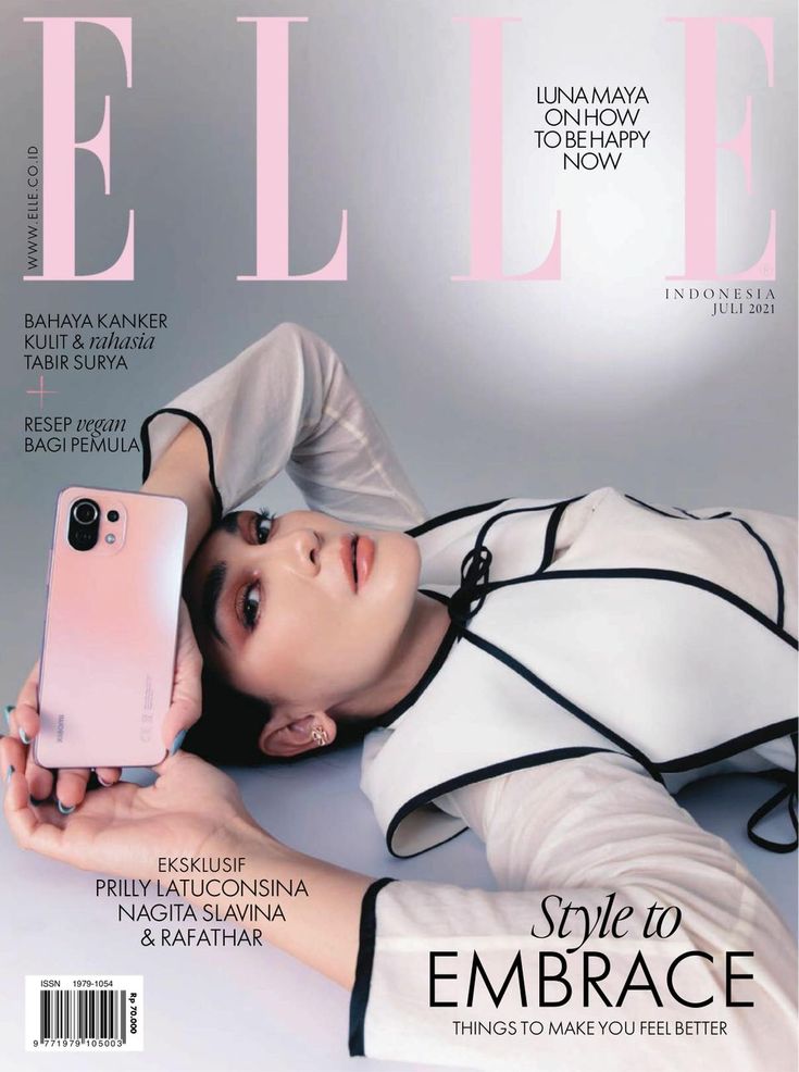 a magazine cover with an image of a woman laying on the floor holding a cell phone