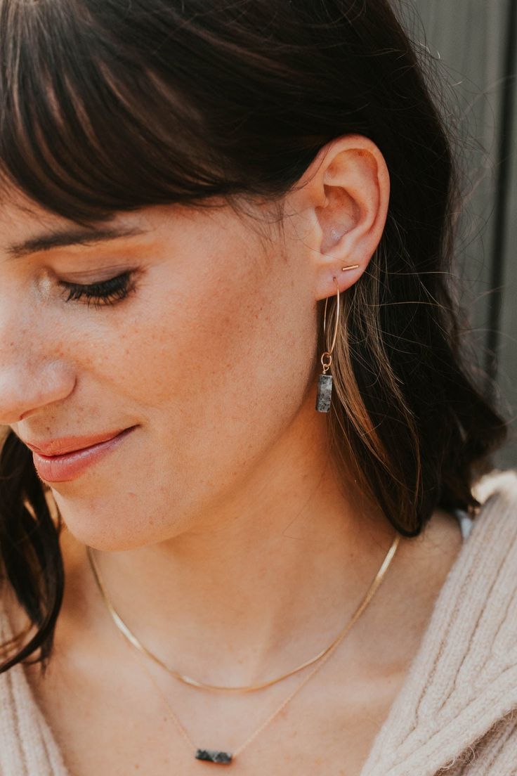 These simple studs are officially raising the BAR. Pair with your other favorite earring—we love combining these with anything from our MINI Collection, or wear these as the main act. A favorite, versatile, everyday stud. Bar measures 1mm x 10mm or 1mm x 6mm. Sold as a pair. Shown on Abbie with our Tiny Twist Earrings. Available in 14kt Gold Fill + Sterling Silver. Our jewelry is handmade so each piece will be unique and may vary slightly from what is pictured.