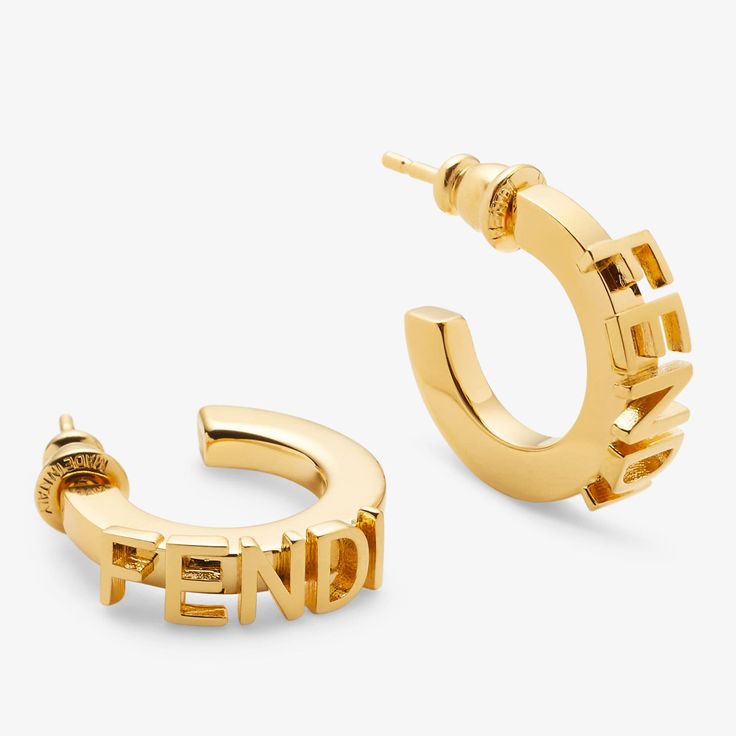 Hoop earrings with Fendi lettering. Made of metal with a gold finish. Made in Italy Metal Earrings, Earrings Gold, Gold Finish, Gold Earrings, Gold Color, Fendi, Hoop Earrings, Fashion Jewelry, In Italy