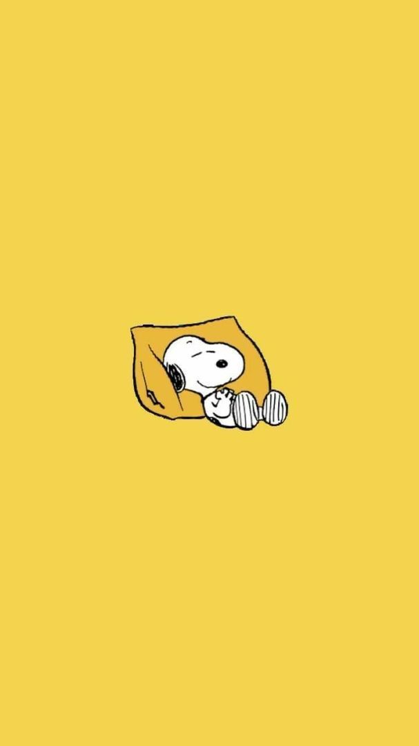 a cartoon character laying on top of a yellow blanket