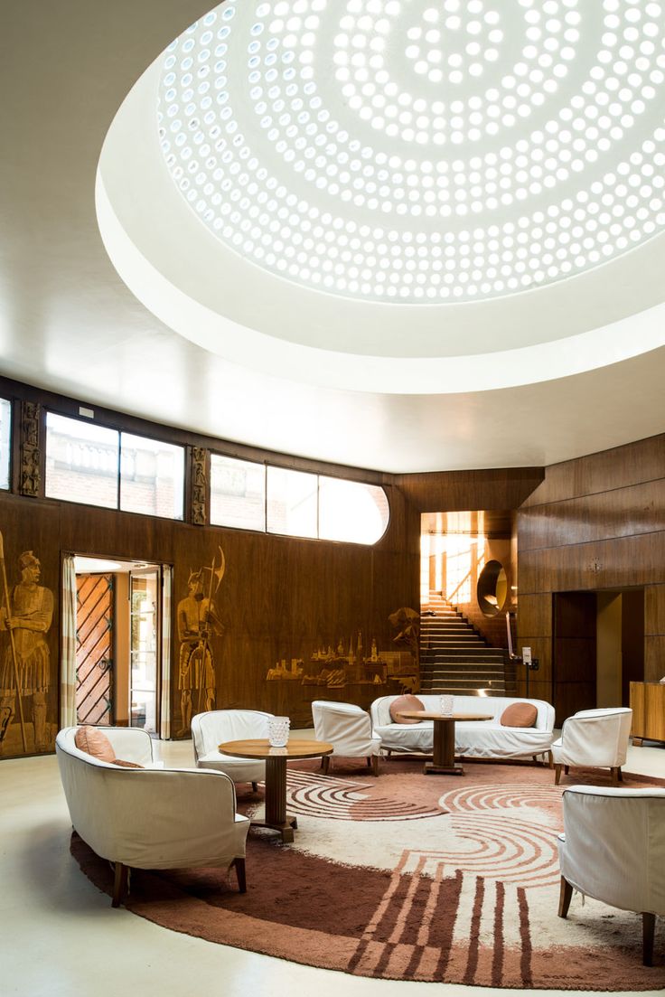 the lobby is decorated with art deco furniture