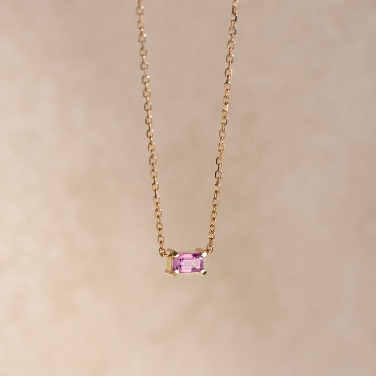 A simple solitaire pink sapphire necklace 14K gold for women. The stone is natural genuine sapphire in octagon-emerald cut. This dainty necklace is a great Valentines Day gift for her. ● Metal: 14Κ Gold ● Stone: Sapphire ● Weight: 0.37ct ● Stone's dimensions: 5mm x 3mm ● Cut: Octagon Cut ● Necklace length: 40cm G I F T S All our pieces are delivered beautifully packaged and gift ready with a certificate of authenticity for the metal and the stone. P R O D U C T I O N ∙ T I M E * S H I P P I N G * P O L I C I E S Please keep in mind that each item is handcrafted, and we need 5 days at least for its production. If you need your order on a specific date, please contact us. All orders are shipped worldwide via FedEx Express for speed and security. The estimated delivery time is 3 days to the U Elegant Yellow Gold Necklaces With Pink Sapphire, Pink Solitaire Dainty Jewelry, Rose Gold Solitaire Pink Sapphire Jewelry, Yellow Gold Pink Sapphire Necklace, Fine Jewelry With Pink Sapphire In Prong Setting, Fine Jewelry Pink Sapphire With Prong Setting, Pink Gold Solitaire 14k Bracelet, Pink Gold Solitaire 14k Gold Jewelry, Pink Sapphire Jewelry As A Gift