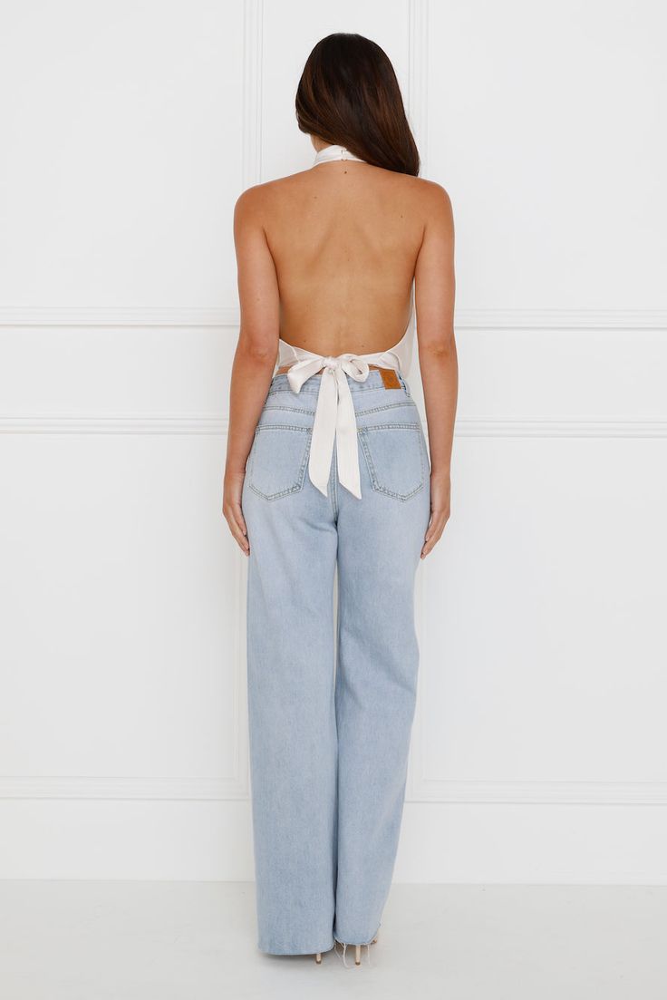 Length from shoulder to hem of size S: 44cm. Top. Lined. Model is a standard XS and is wearing size XS. True to size. Non-stretch. Halterneck with button closures. Tie-up back. Satin. Textured fabrication. Slip on. Cold hand wash only. Polyester. Elevate your 'fit with the Pippin Satin Halter Crop Top. Featuring a halterneck with button closures, a tie-up back and a silky, satin fabrication. Style with pants and heels. Style With Pants, Cold Hands, Halter Crop Top, Champagne, Crop Top, Hand Wash, Slip On, Satin, Crop Tops