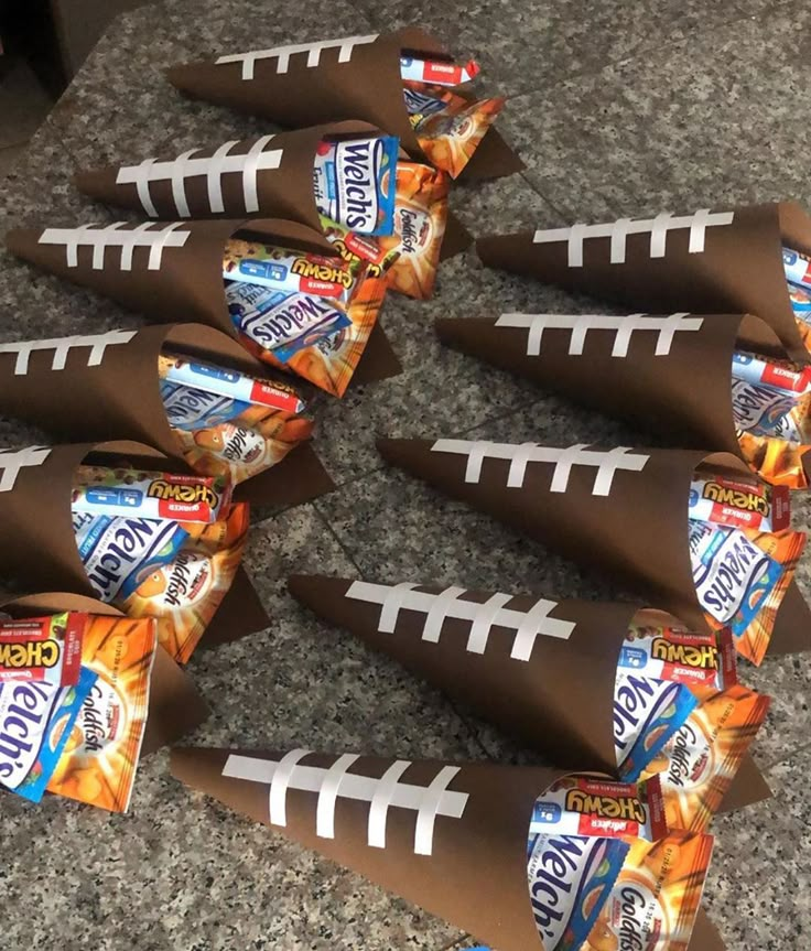 football shaped candy wrappers are laid out on the ground