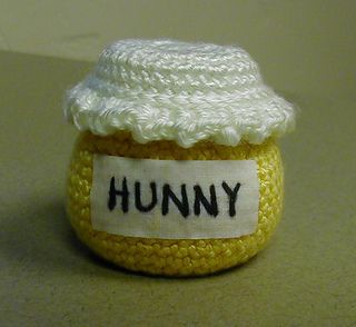 a crocheted honey jar with a label that says, hummy on it