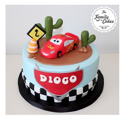 a birthday cake for a child's first birthday with cars and cactus on top